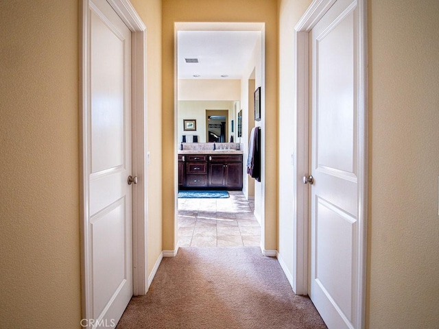 9275 Serenity St, Riverside, CA 92508 - corridor featuring light carpet and baseboards