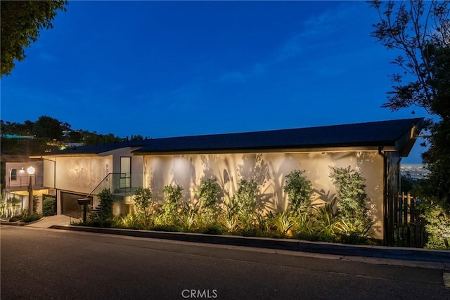9336 Lloydcrest Dr, Beverly Hills, CA 90210 - property exterior at twilight featuring stucco siding