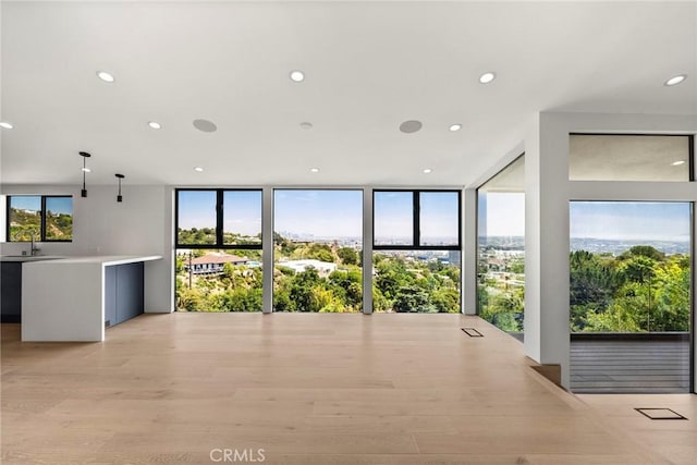 9336 Lloydcrest Dr, Beverly Hills, CA 90210 - unfurnished living room featuring light wood-style flooring and recessed lighting