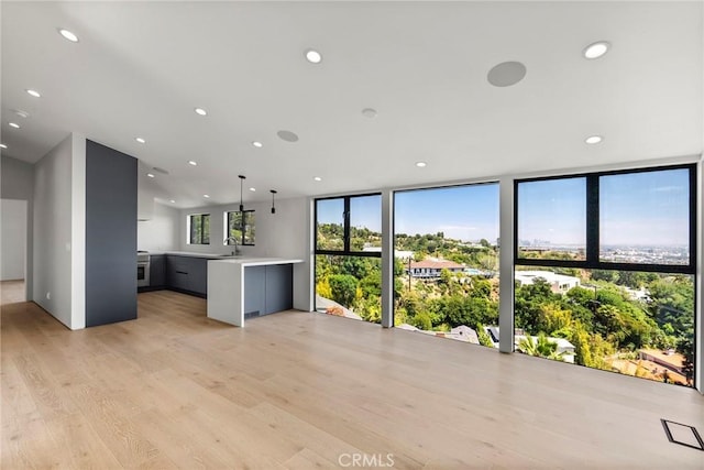 9336 Lloydcrest Dr, Beverly Hills, CA 90210 - kitchen featuring light countertops, light wood-type flooring, and recessed lighting