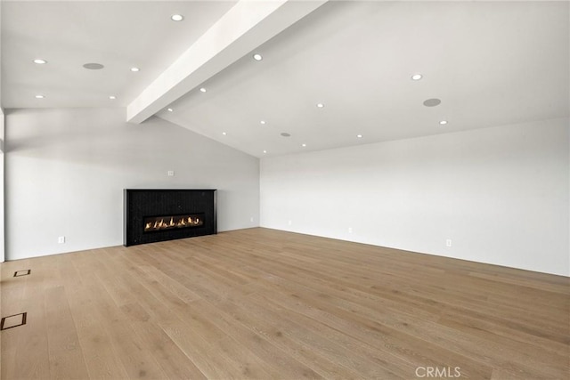 9336 Lloydcrest Dr, Beverly Hills, CA 90210 - unfurnished living room featuring light wood-style flooring, a glass covered fireplace, and recessed lighting