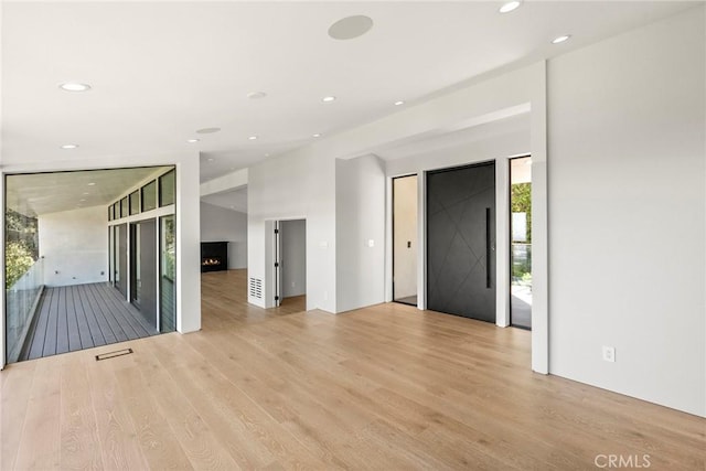 9336 Lloydcrest Dr, Beverly Hills, CA 90210 - foyer entrance featuring light wood-type flooring and recessed lighting