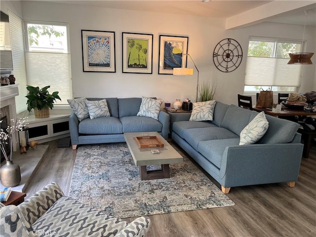 2577 Plaza Del Amo Unit 712, Torrance, CA 90503 - living room featuring wood finished floors and a fireplace
