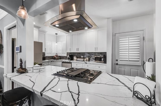 4708 W 132nd St, Hawthorne, CA 90250 - kitchen with exhaust hood, appliances with stainless steel finishes, backsplash, and light stone countertops