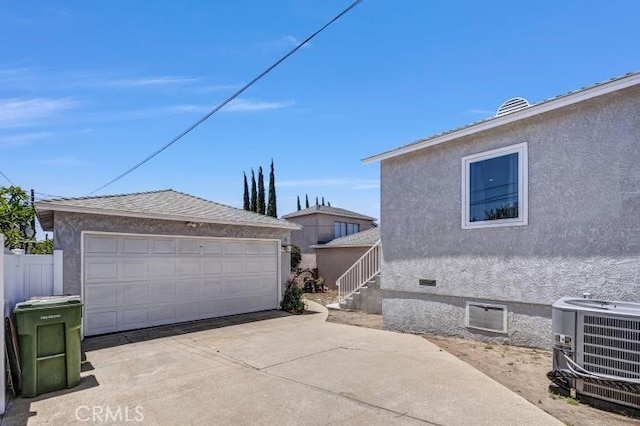4708 W 132nd St, Hawthorne, CA 90250 - view of side of home with an outdoor structure, a detached garage, stucco siding, and crawl space