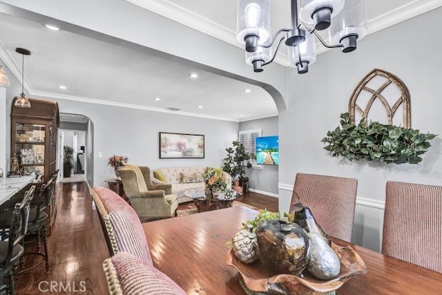 4708 W 132nd St, Hawthorne, CA 90250 - dining area with arched walkways, wood finished floors, a chandelier, recessed lighting, and crown molding