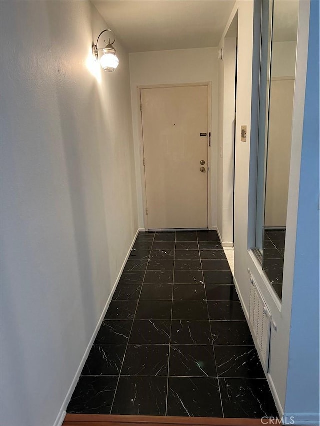 5257 Radford Ave Unit 308, Valley Village, CA 91607 - hall with dark marble finish floors and baseboards