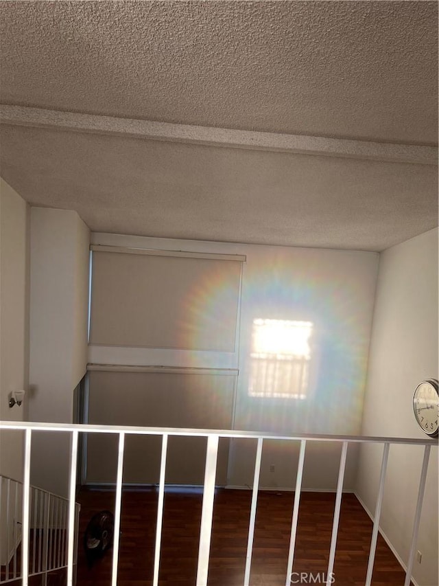 5257 Radford Ave Unit 308, Valley Village, CA 91607 - corridor featuring wood finished floors and a textured ceiling