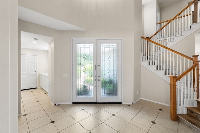 45339 Tiburcio Dr, Temecula, CA 92592 - entryway with stairs, light tile patterned floors, french doors, and a high ceiling