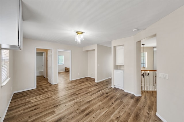 45339 Tiburcio Dr, Temecula, CA 92592 - spare room with wood finished floors and a chandelier