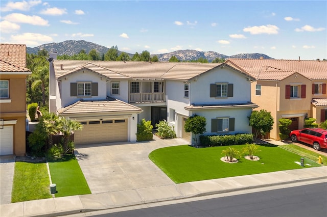 45339 Tiburcio Dr, Temecula, CA 92592 - mediterranean / spanish house featuring a mountain view, a tile roof, stucco siding, an attached garage, and concrete driveway