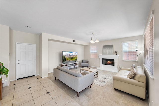 45339 Tiburcio Dr, Temecula, CA 92592 - living area with light tile patterned floors and a glass covered fireplace