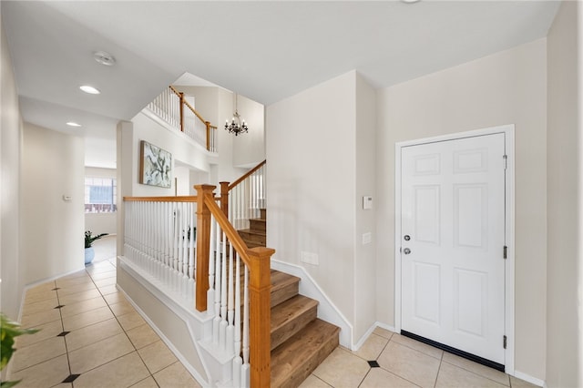 45339 Tiburcio Dr, Temecula, CA 92592 - entryway featuring light tile patterned floors, recessed lighting, a chandelier, and stairs