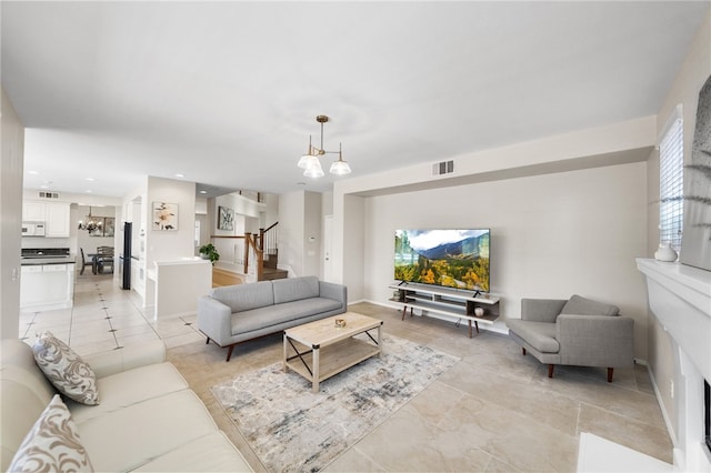 45339 Tiburcio Dr, Temecula, CA 92592 - living area featuring a chandelier, stairway, light tile patterned floors, and recessed lighting