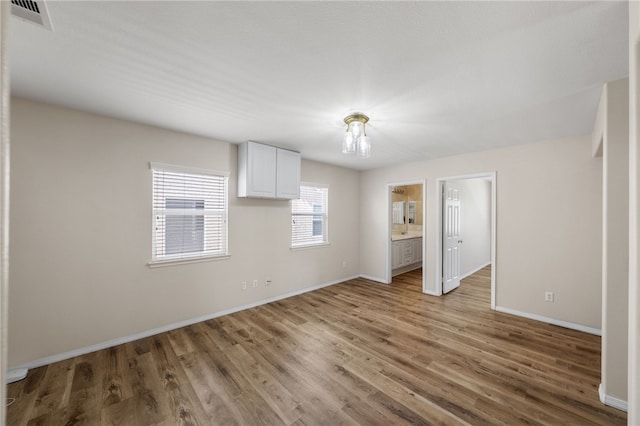 45339 Tiburcio Dr, Temecula, CA 92592 - unfurnished bedroom with light wood finished floors and ensuite bath