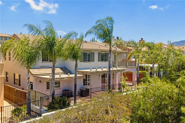45339 Tiburcio Dr, Temecula, CA 92592 - rear view of house with stucco siding and a tiled roof