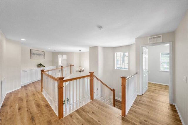 45339 Tiburcio Dr, Temecula, CA 92592 - hall featuring an upstairs landing, plenty of natural light, a chandelier, light wood-style floors, and recessed lighting