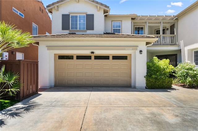 45339 Tiburcio Dr, Temecula, CA 92592 - view of front of home featuring an attached garage, driveway, stucco siding, and a tiled roof