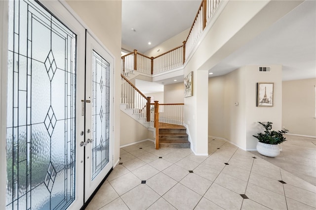 45339 Tiburcio Dr, Temecula, CA 92592 - entrance foyer featuring stairs, light tile patterned floors, and a high ceiling