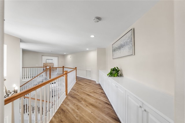 45339 Tiburcio Dr, Temecula, CA 92592 - corridor with an upstairs landing, light wood-style flooring, and recessed lighting