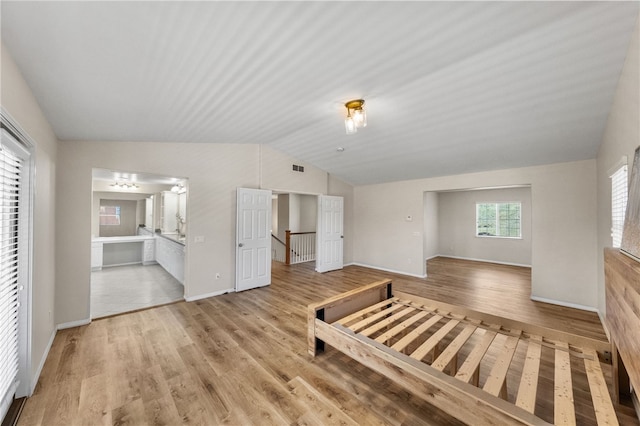 45339 Tiburcio Dr, Temecula, CA 92592 - unfurnished living room featuring lofted ceiling and light wood-type flooring
