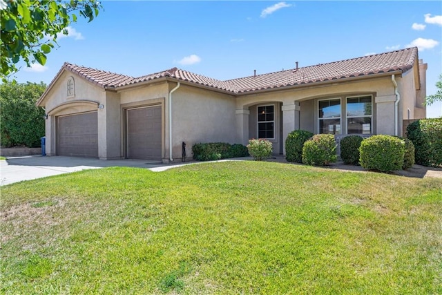 42619 Meridian Way, Lancaster, CA 93536 - mediterranean / spanish home with a garage, stucco siding, a front lawn, concrete driveway, and a tiled roof