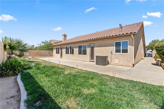 42619 Meridian Way, Lancaster, CA 93536 - back of house with stucco siding, a fenced backyard, a patio, a chimney, and a tiled roof