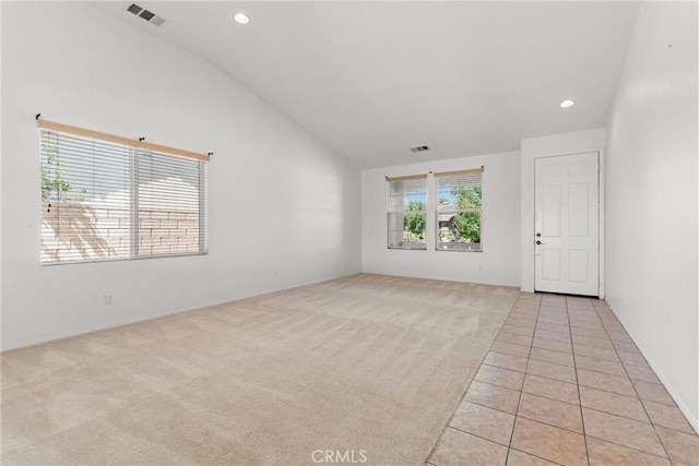 42619 Meridian Way, Lancaster, CA 93536 - spare room with vaulted ceiling, light colored carpet, recessed lighting, and light tile patterned floors