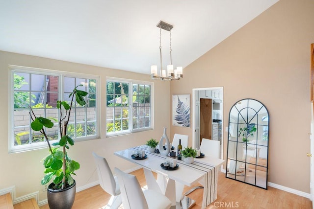 20329 Rim Ridge Rd, Walnut, CA 91789 - dining room featuring a chandelier, light wood-style flooring, and high vaulted ceiling