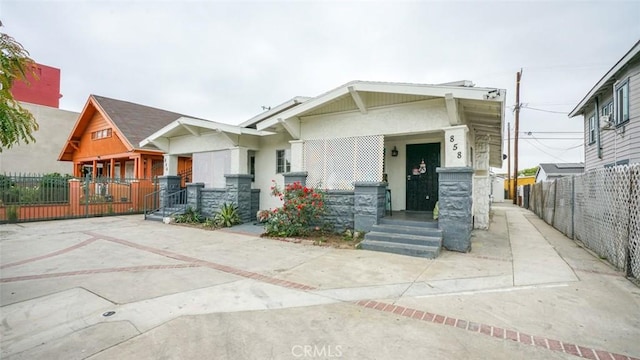856 W 47th St, Los Angeles, CA 90037 - view of front of home featuring covered porch and stucco siding