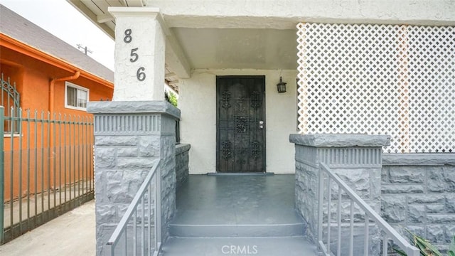 856 W 47th St, Los Angeles, CA 90037 - doorway to property with stucco siding and stone siding