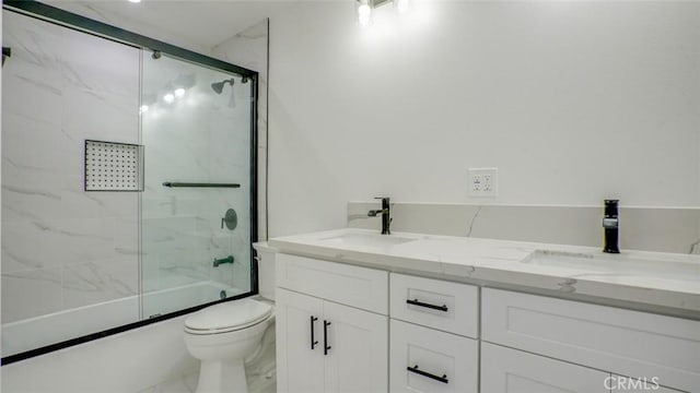 856 W 47th St, Los Angeles, CA 90037 - bathroom featuring marble look tile flooring, shower / bath combination with glass door, and double vanity