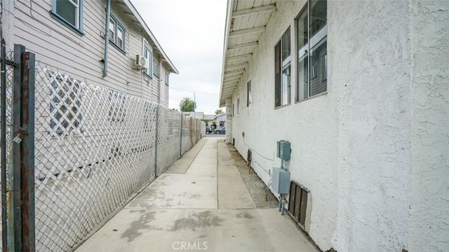 856 W 47th St, Los Angeles, CA 90037 - view of side of home featuring stucco siding and a patio area