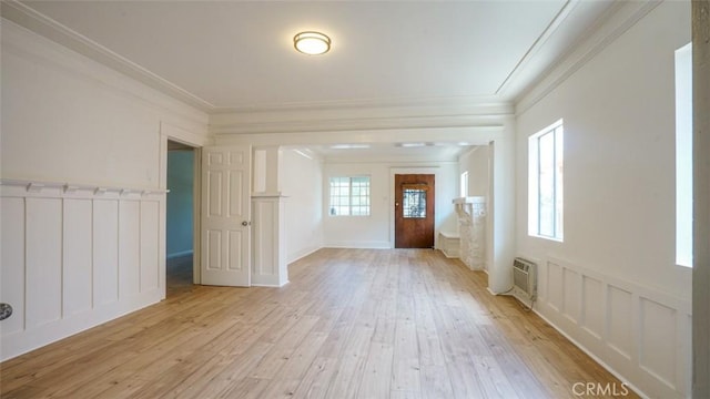 856 W 47th St, Los Angeles, CA 90037 - foyer entrance featuring ornamental molding, plenty of natural light, and light wood-style flooring
