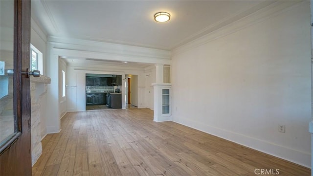 856 W 47th St, Los Angeles, CA 90037 - unfurnished living room featuring ornamental molding and light wood-style flooring