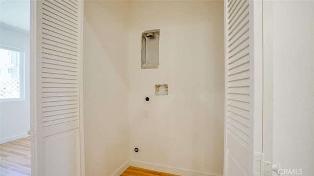 856 W 47th St, Los Angeles, CA 90037 - washroom featuring hookup for an electric dryer, light wood finished floors, and washer hookup