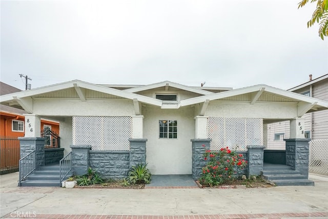 856 W 47th St, Los Angeles, CA 90037 - view of front facade featuring covered porch and stucco siding