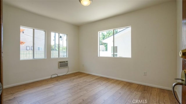 856 W 47th St, Los Angeles, CA 90037 - empty room featuring hardwood / wood-style flooring and a wall mounted air conditioner