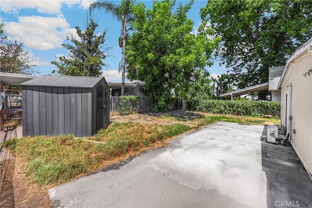 1003 Stevenson St, Colton, CA 92324 - view of yard with a storage shed and a patio area