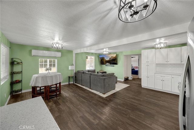 1003 Stevenson St, Colton, CA 92324 - dining space with a wall mounted AC, a textured ceiling, a chandelier, and dark wood finished floors