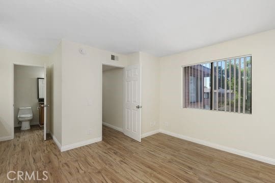 1313 Massachusettes Ave Unit 203, Riverside, CA 92507 - unfurnished room with wood finished floors and baseboards