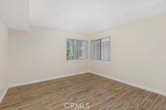 1313 Massachusettes Ave Unit 203, Riverside, CA 92507 - empty room featuring wood finished floors and baseboards