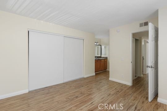 1313 Massachusettes Ave Unit 203, Riverside, CA 92507 - spare room featuring light wood-style floors and baseboards