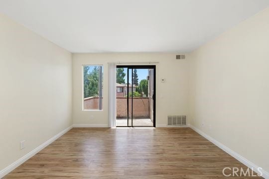 1313 Massachusettes Ave Unit 203, Riverside, CA 92507 - unfurnished room with wood finished floors and baseboards