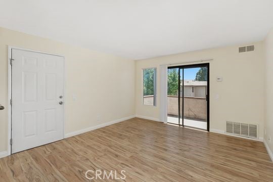 1313 Massachusettes Ave Unit 203, Riverside, CA 92507 - spare room featuring light wood-style floors