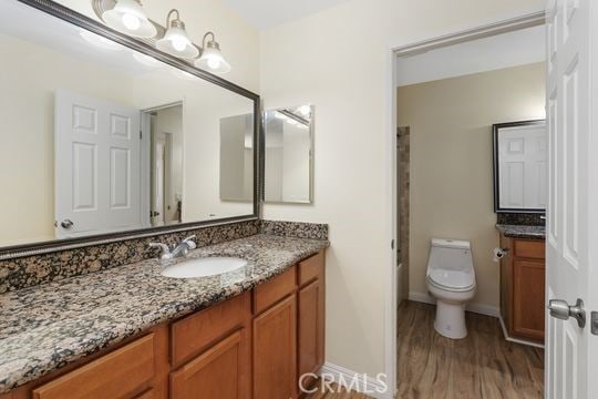 1313 Massachusettes Ave Unit 203, Riverside, CA 92507 - bathroom with vanity, wood finished floors, and bathtub / shower combination