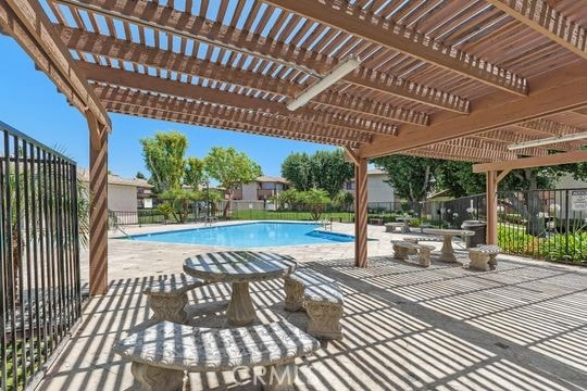 1313 Massachusettes Ave Unit 203, Riverside, CA 92507 - community pool with a pergola and a patio area