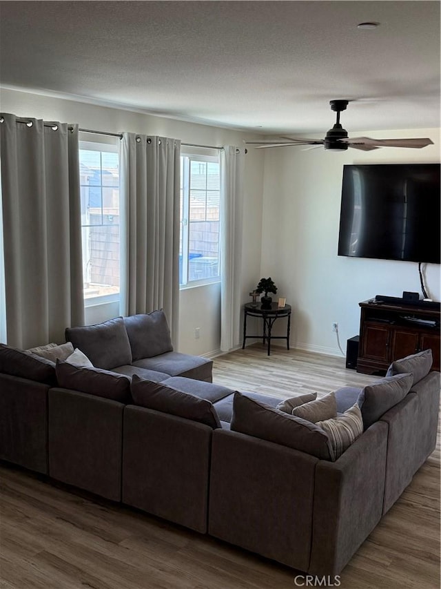 12708 Ojo Caliente St, Victorville, CA 92392 - living room with ceiling fan and wood finished floors