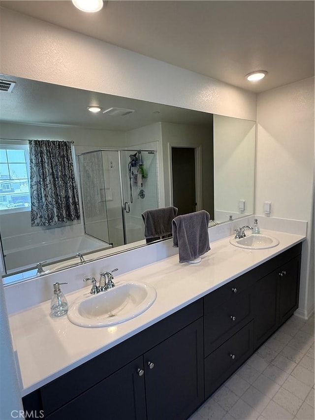 12708 Ojo Caliente St, Victorville, CA 92392 - bathroom featuring double vanity, a shower stall, a bath, and tile patterned flooring