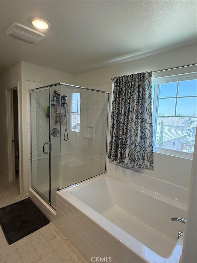 12708 Ojo Caliente St, Victorville, CA 92392 - full bathroom featuring a bath and a shower stall